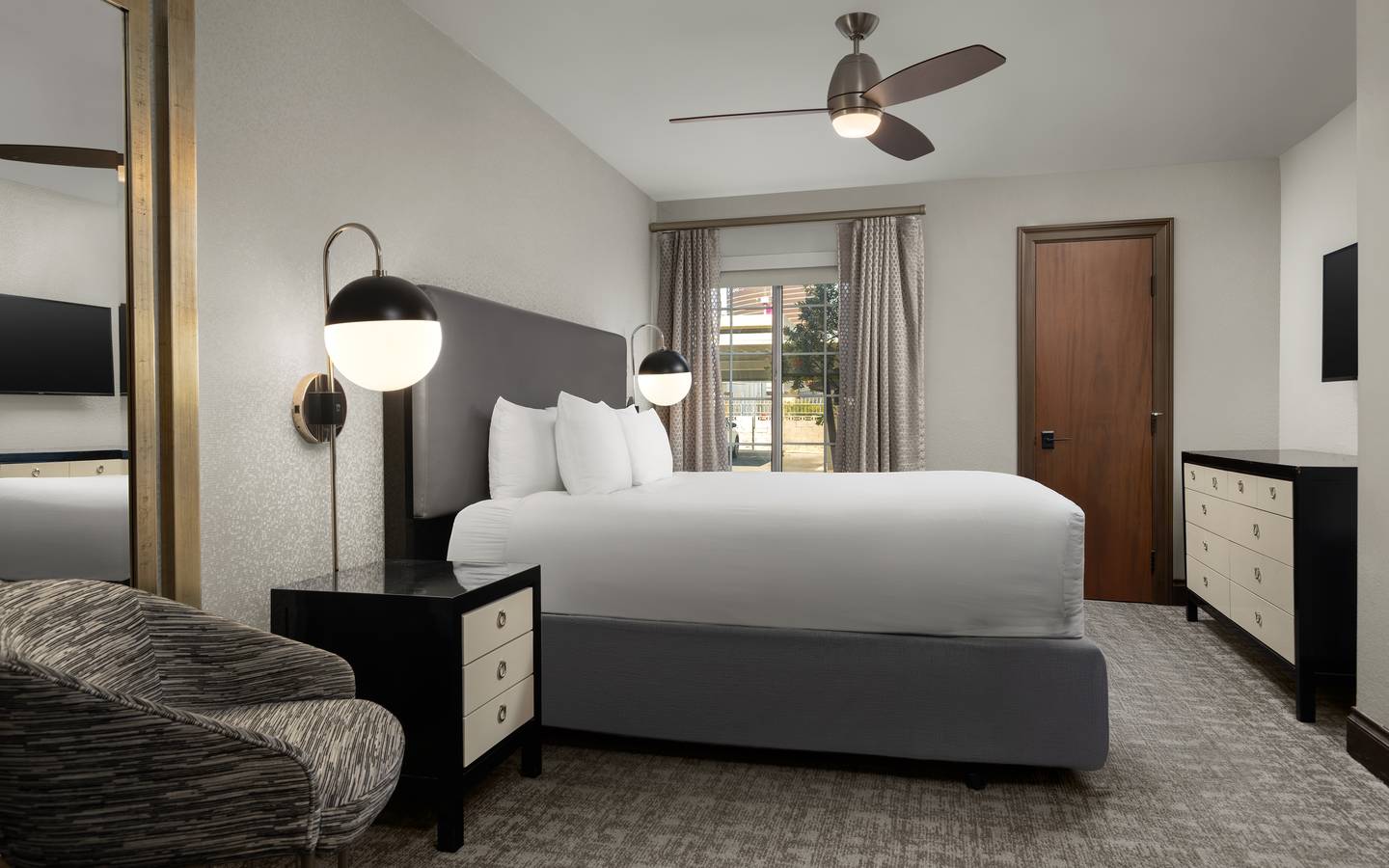 Bedroom with modern lighting and contemporary decor.