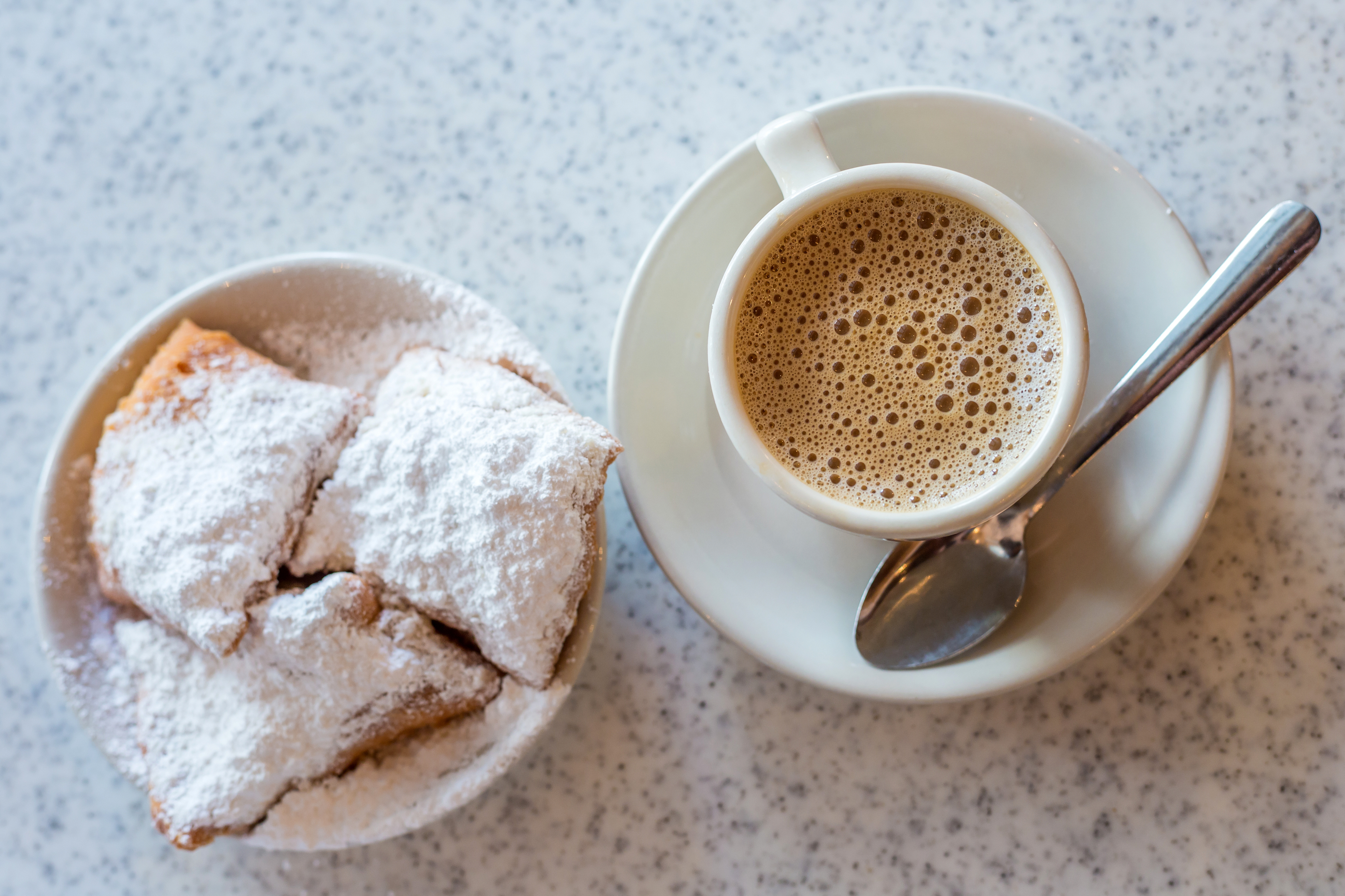A cup of coffee and three beignets in New Orleans.
