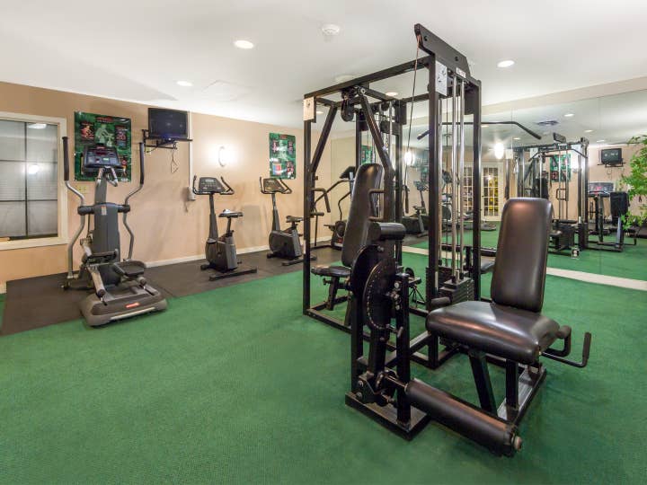 Fitness center with elliptical machines, stationary bicycles and weights at Timber Creek Resort in De Soto, Missouri.
