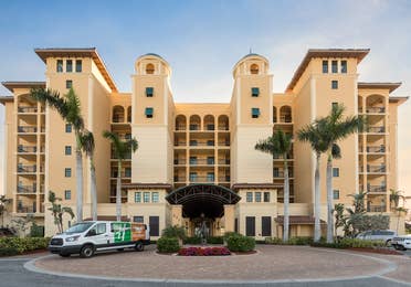 Outdoor view of Sunset Cove Resort with shuttle in the front