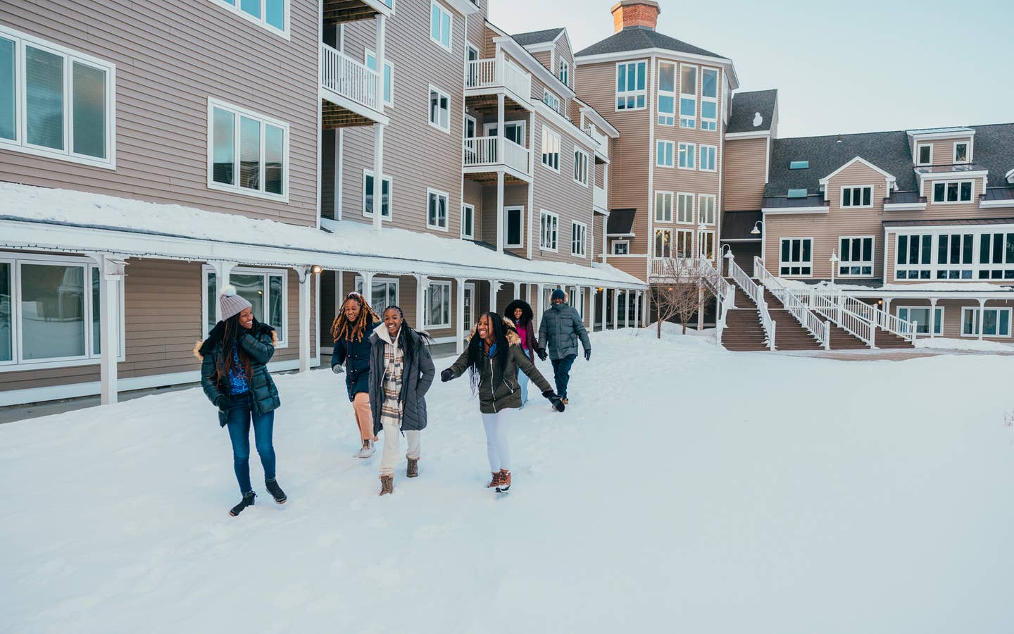 People walking through snow at Mountain Ascutney Resort.