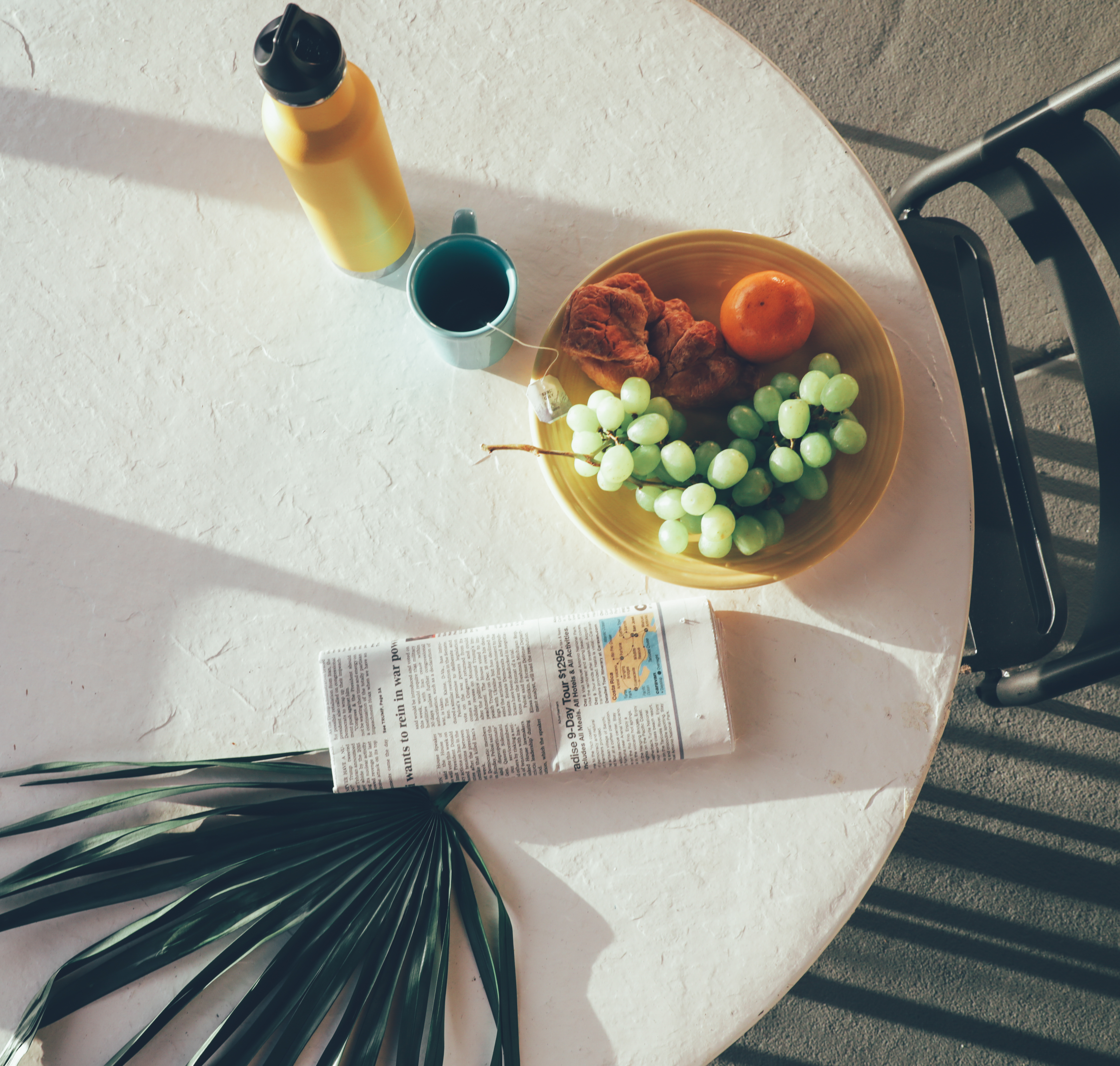 Table with plate of breakfast and cup of tea in a villa in North Village at Orange Lake Resort near Orlando, Florida