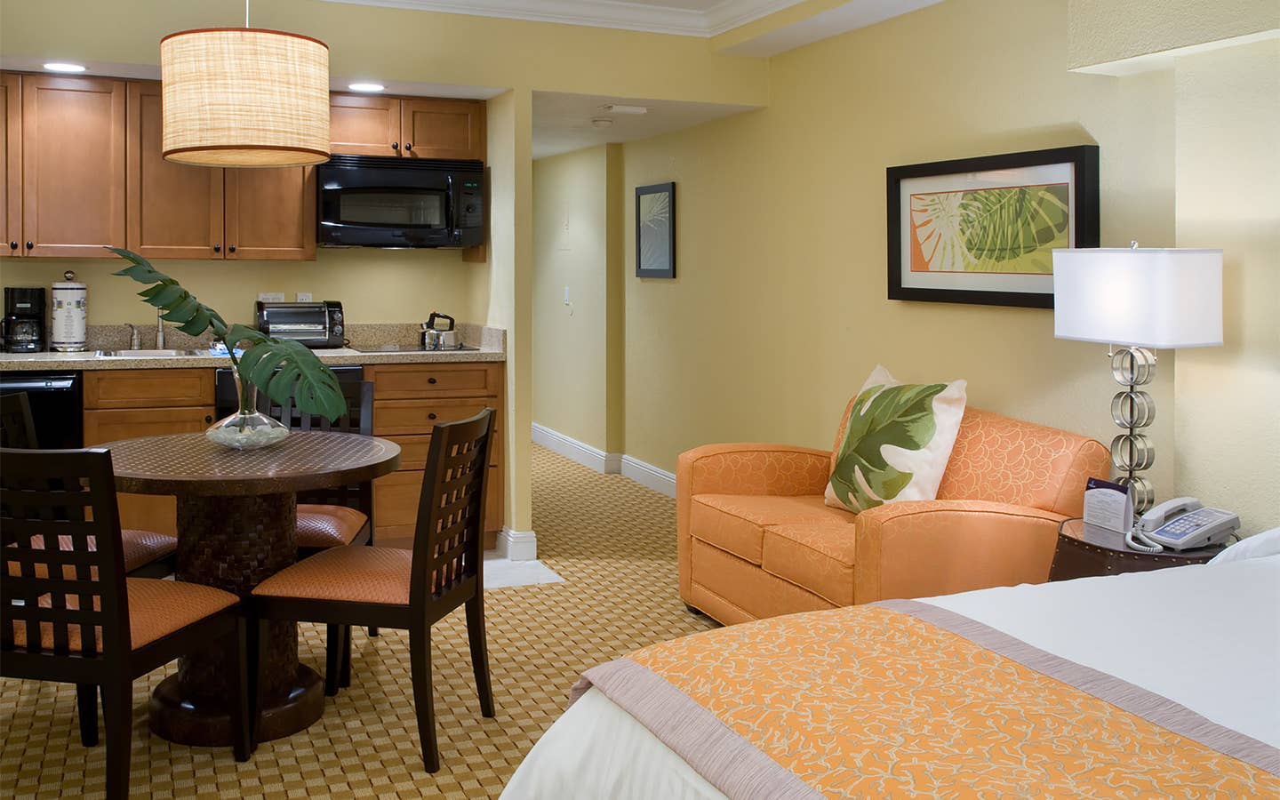 Small dining area and kitchenette in a studio room in West Village at Orange Lake Resort near Orlando, FL