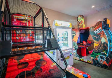 Arcade with Pop-a-Shot, Jurassic Park Raw Thrills and Key Faster games at Villages Resort in Flint, Texas