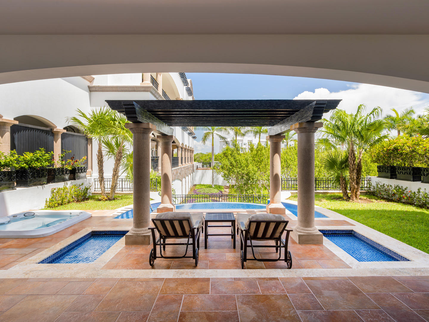 Master suite terrace with private pool and garden views.