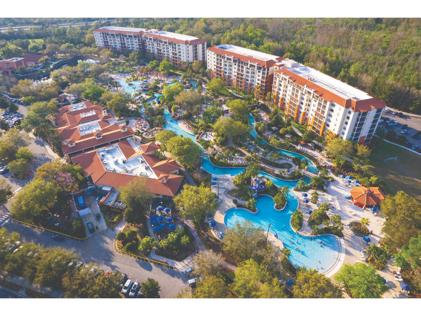 Aerial view of Orange Lake Resort with pools and lush landscaping.