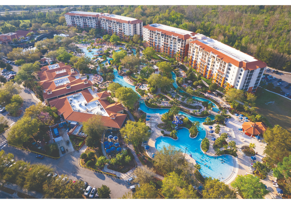 Aerial view of Orange Lake Resort with pools and lush landscaping.