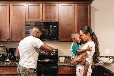 Family cooking in a kitchen in a villa