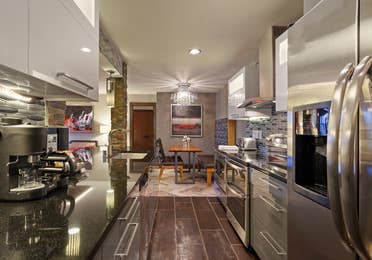 Kitchen and dining area in a Signature Villa at Desert Club Resort in Las Vegas