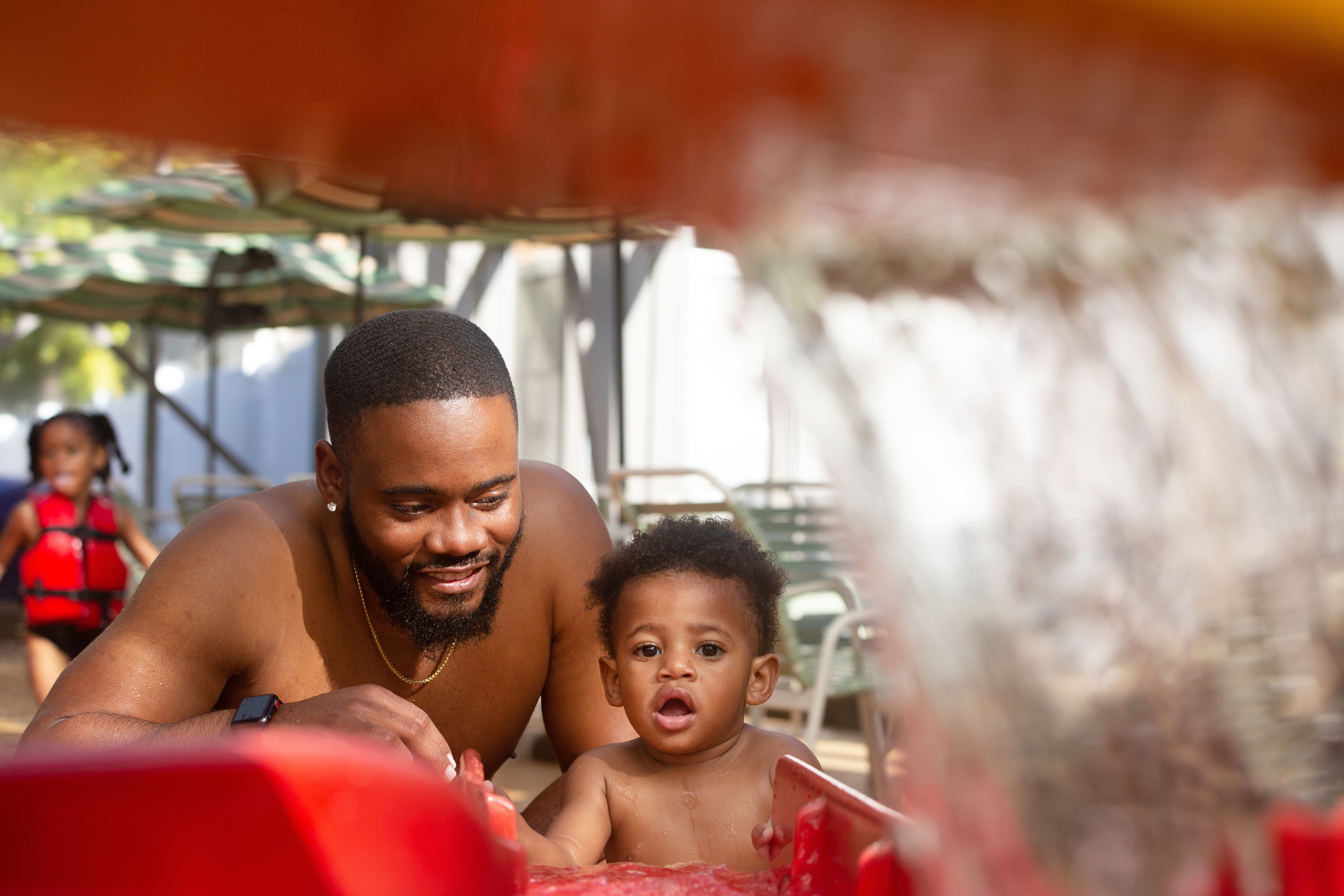 Tina's husband and son playing in the water at the Waterpark at the Villages.