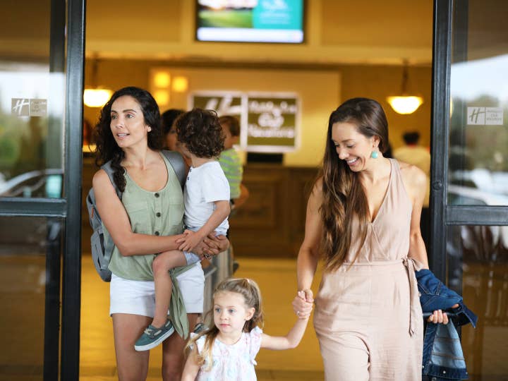 Family finishing check-in at Orange Lake Resort in Orlando, Florida.