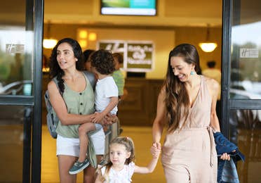 Family finishing check-in at Orange Lake Resort in Orlando, Florida.