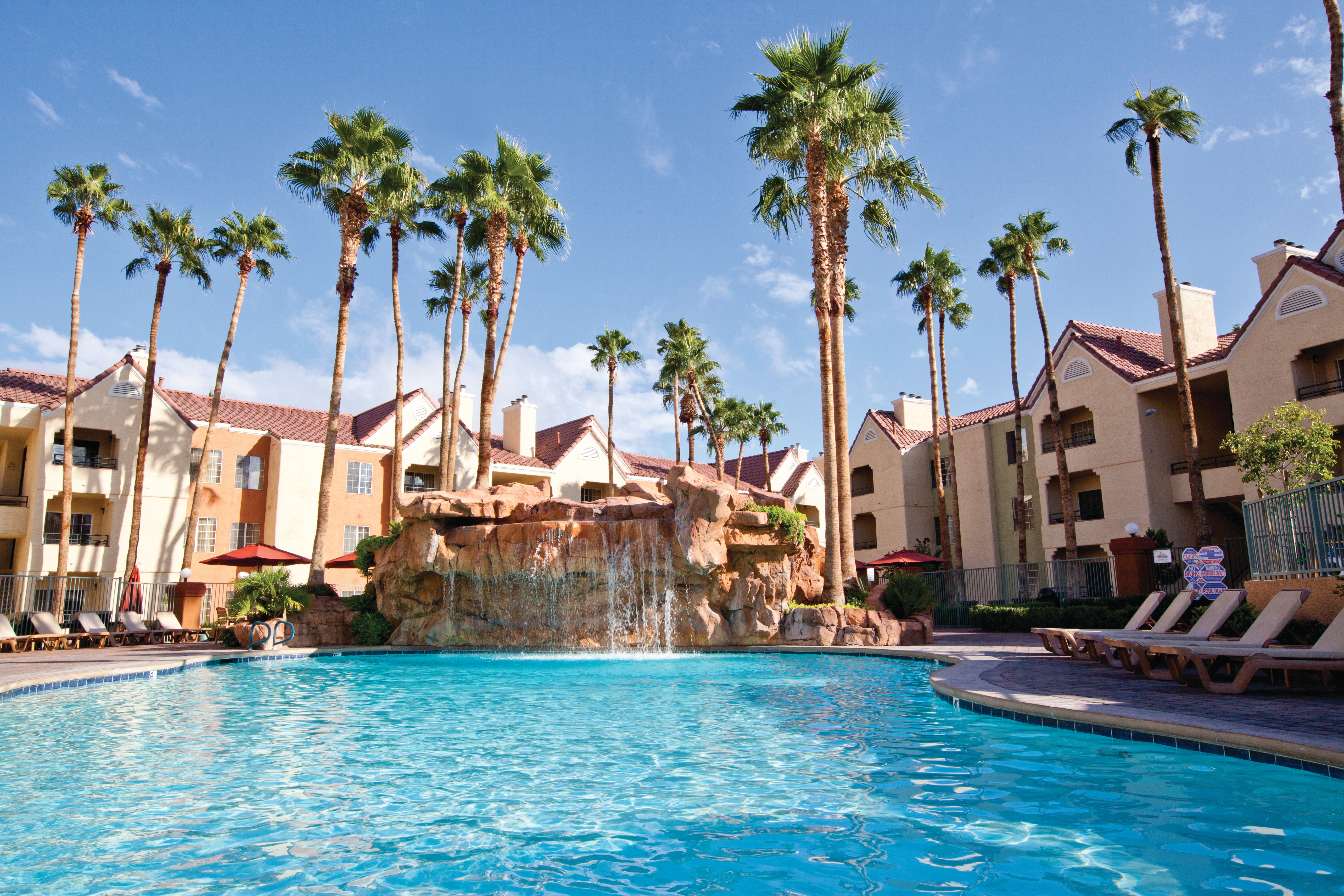 The Watering Hole pool with waterfall at Desert Club Resort in Las Vegas.