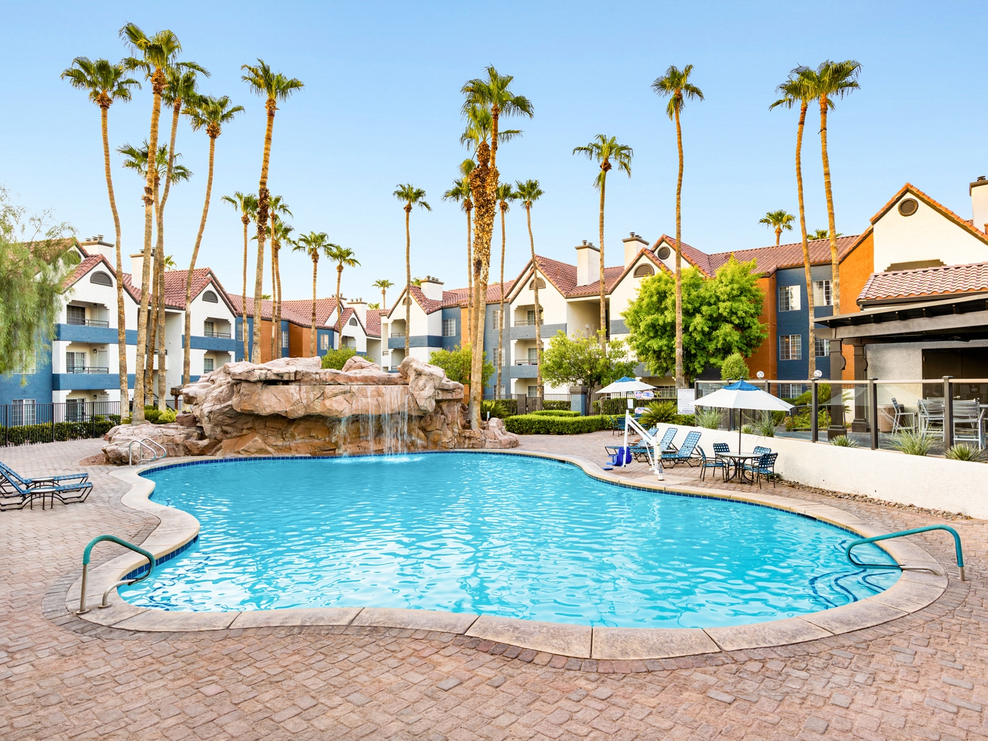 The Watering Hole pool with waterfall at Desert Club Resort in Las Vegas.