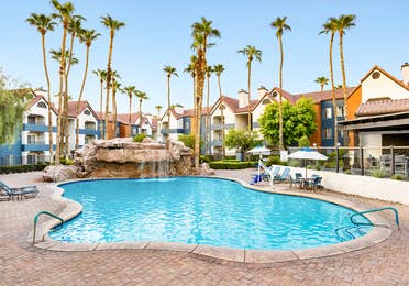 The Watering Hole pool with waterfall at Desert Club Resort in Las Vegas.