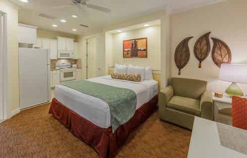 Bedroom with a kitchenette in a two-bedroom presidential villa at Villages Resort