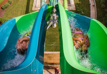 Kids sliding down waterslide at Water Country USA near Williamsburg Resort.