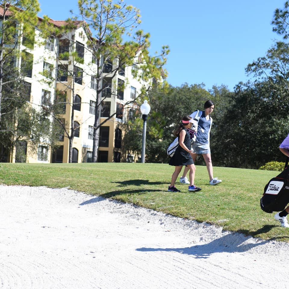 Golfers walking on course in East Village at Orange Lake Resort near Orlando, Florida