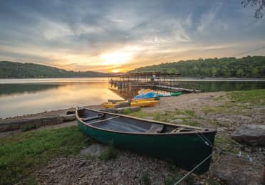 View of boat dock and lake at sunset at Ozark Mountain Resort in Kimberling City, MIssouri.