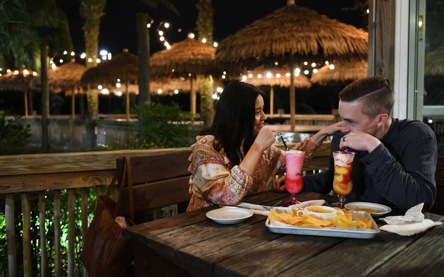 Couple eating at Tradewinds Bar & Grill at Orange Lake Resort near Orlando, Florida.