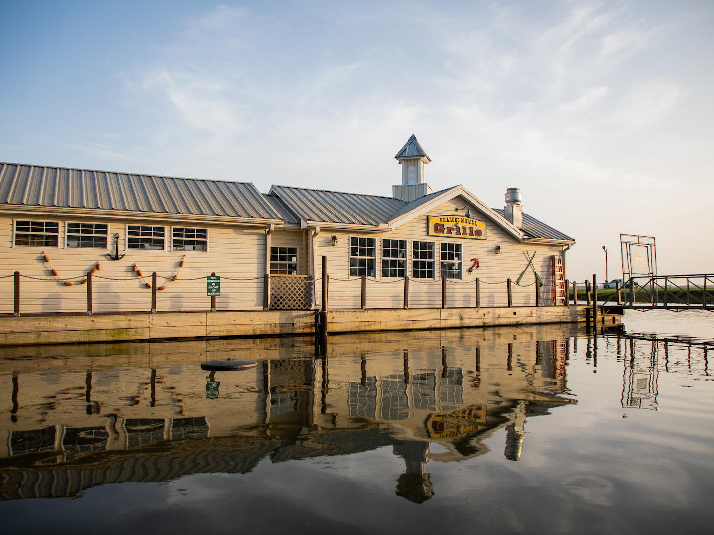 Exterior shot of Marina Grille on water at Villages Resort in Flint, Texas