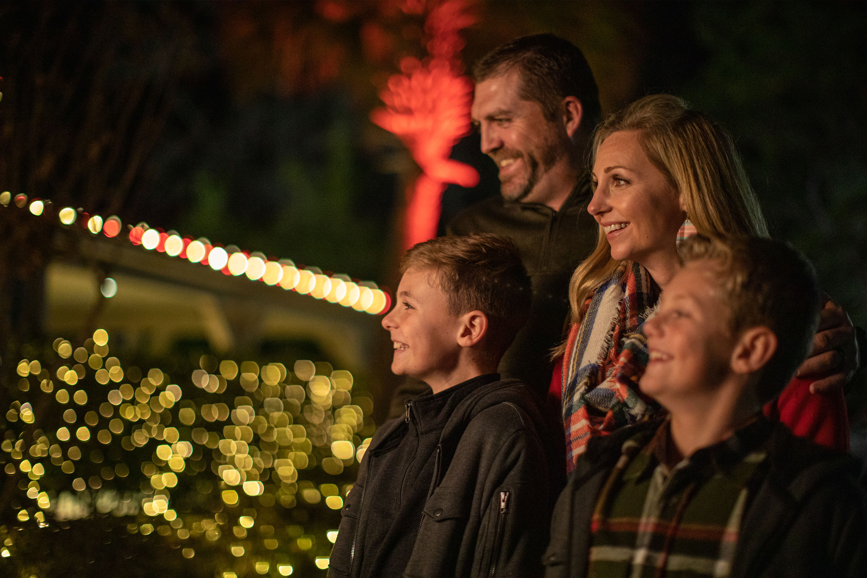 Author, Amanda Nall (right), and her family look at the string lights and enjoy being surrounded by holiday decor.