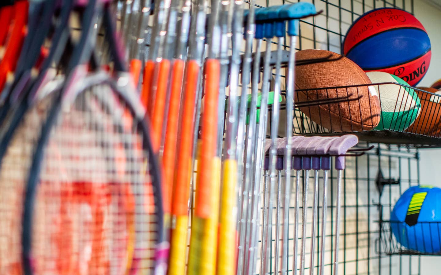 Tennis racket, putters, footballs, soccer balls and basketballs at the Marketplace at Oak n' Spruce Resort in South Lee, Massachusetts.