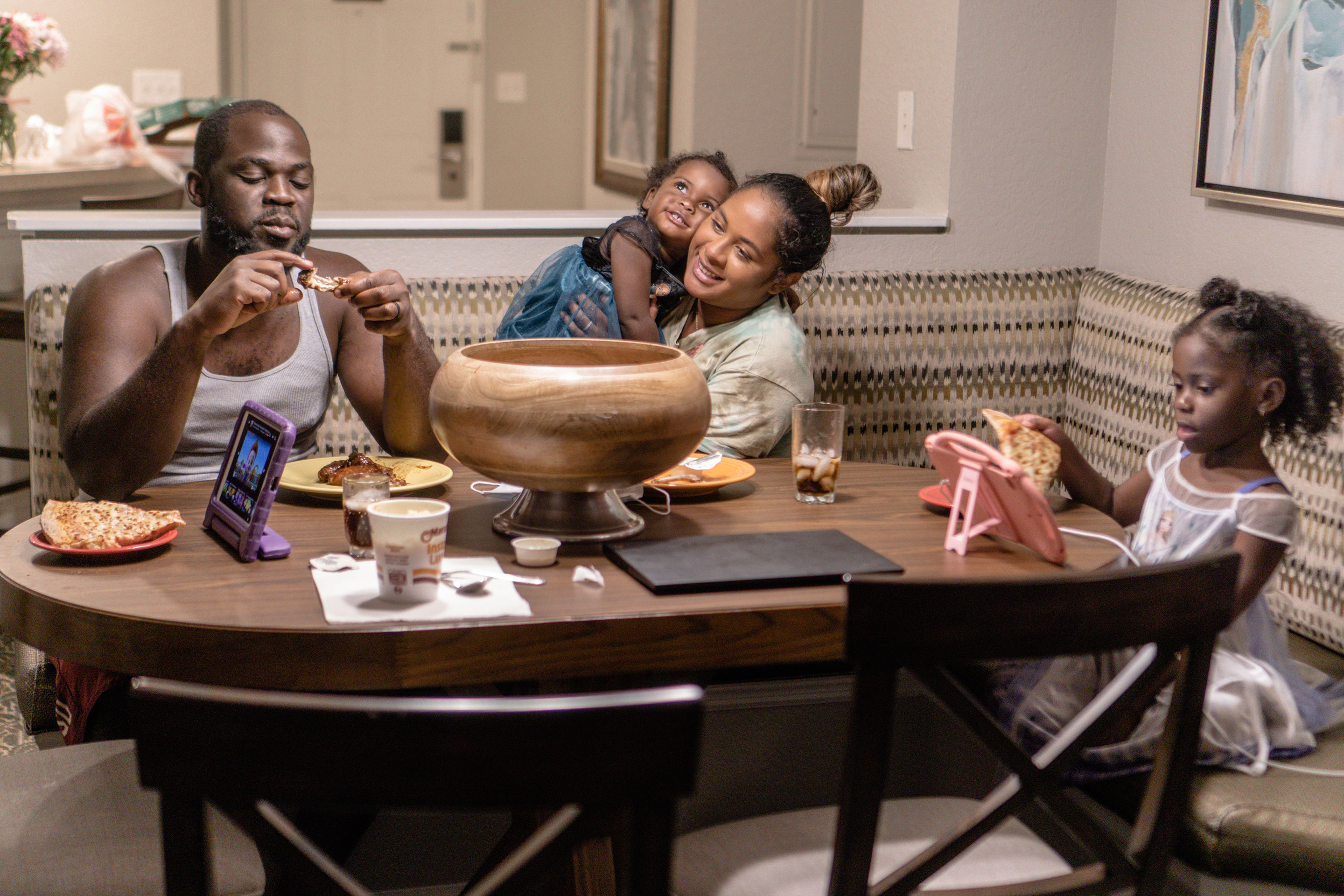 Author, Kimberly Gelin (middle), sits at her dining table in our Villa at Orange Lake Resort in Florida.