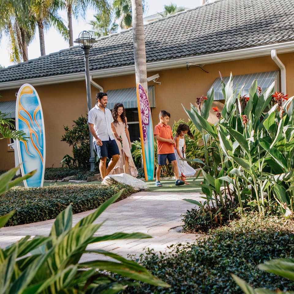 Family walking around property at Cape Canaveral Beach Resort in Florida.