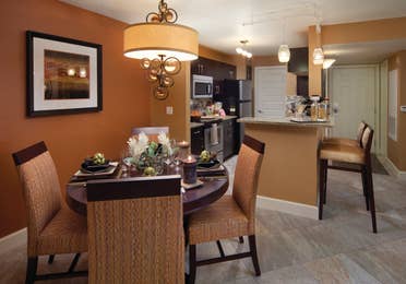 Kitchen and dining area in a two-bedroom villa at Desert Club Resort