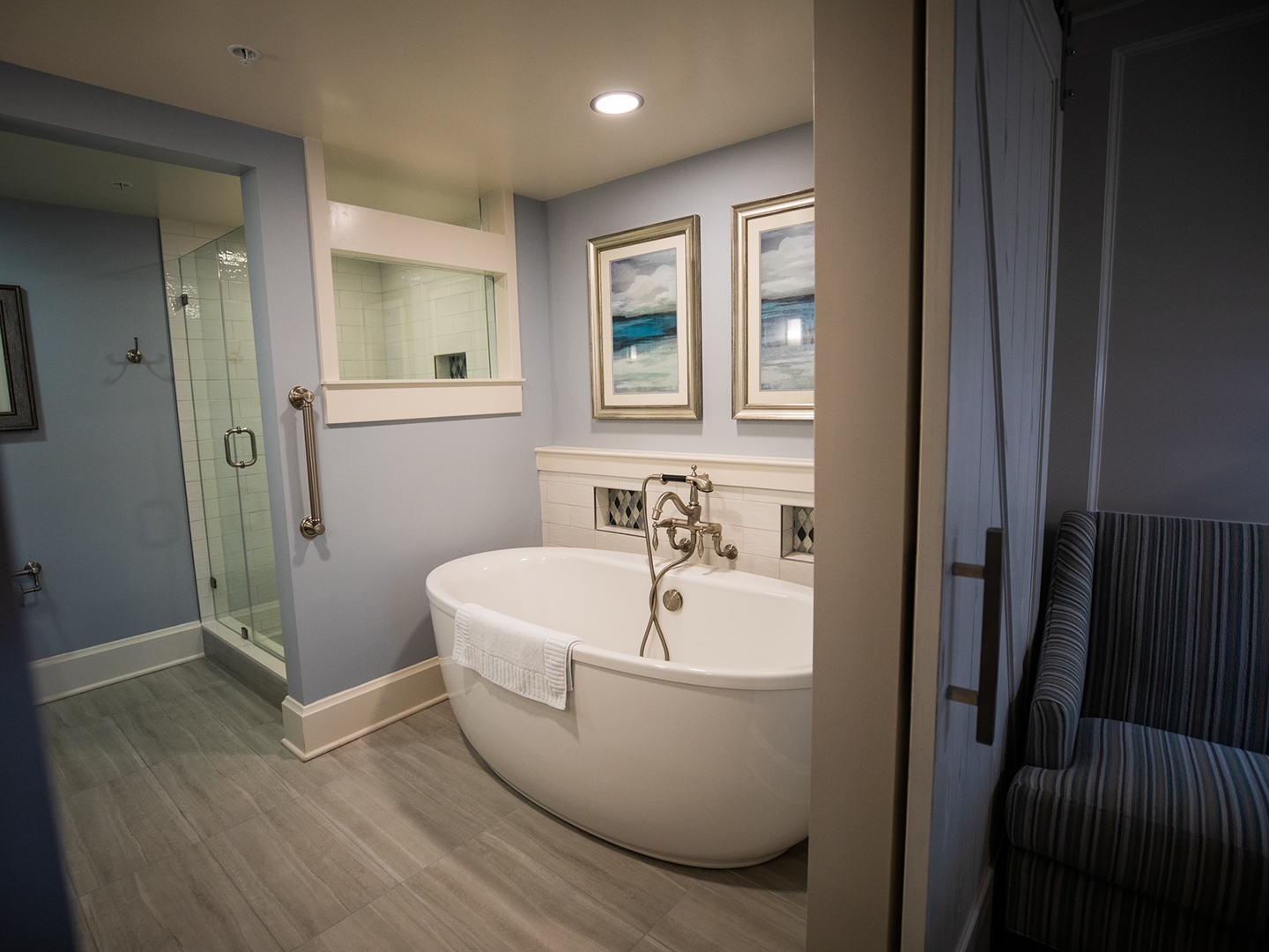 Bathroom with tub and walk-in shower in a two-bedroom Signature Collection villa at Cape Canaveral Beach Resort.