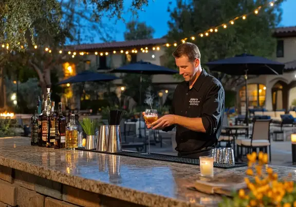 A bartender crafting a signature cocktail at Scottsdale AZ resort.