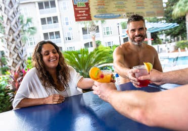 Two adults getting drinks at Splash Cove at South Beach Resort in Myrtle Beach, South Carolina.