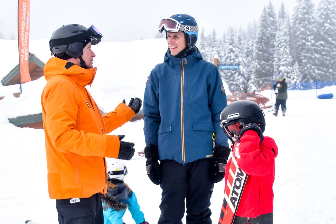 Jessica's Husband (middle) and children talk with the Resort Ski Instructor (left) prior to hitting the slopes.