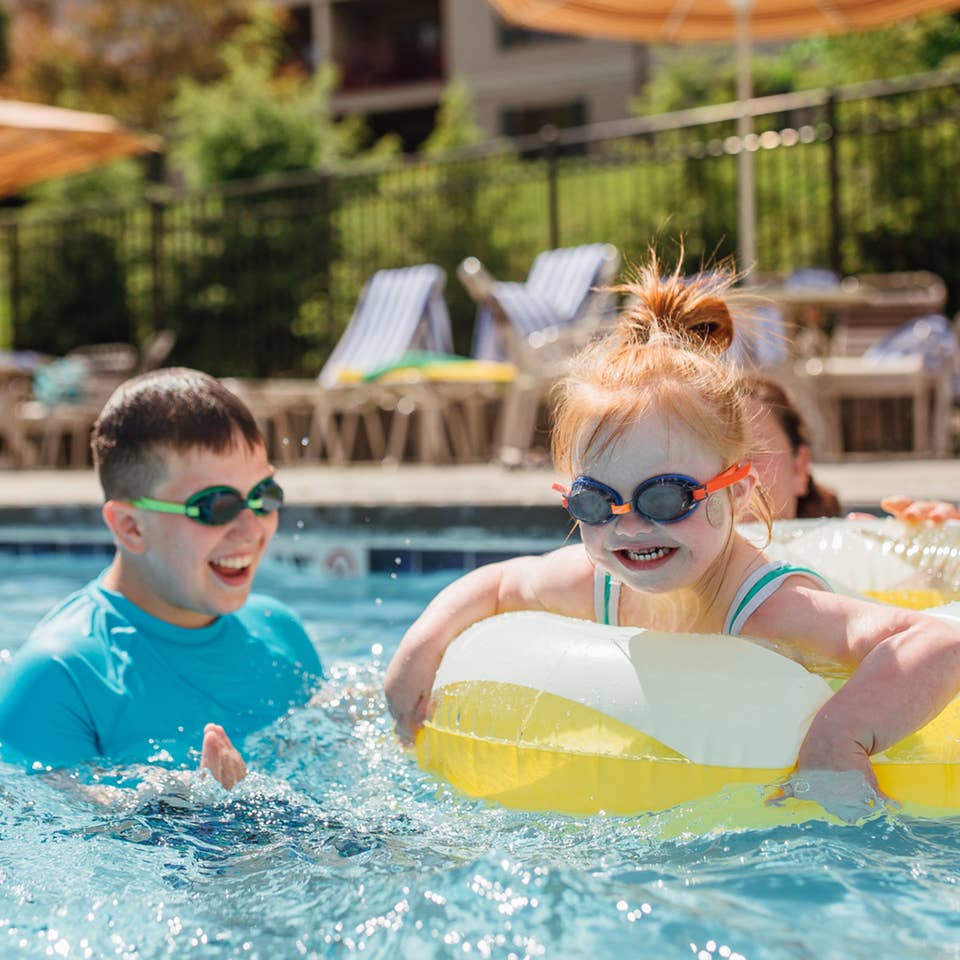 Kids swimming in outdoor pool at Oak n' Spruce Resort in South Lee, Massachusetts.