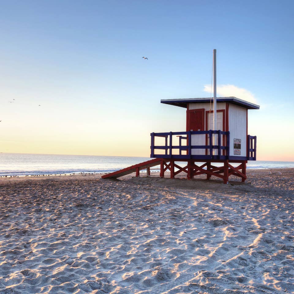 Cape Canaveral Beach with Lifeguard hut at sunset.