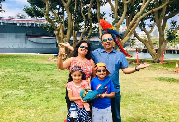 At the San Diego Harbor with my wife, twins and real birds (plus, the USS Midway in the background)
