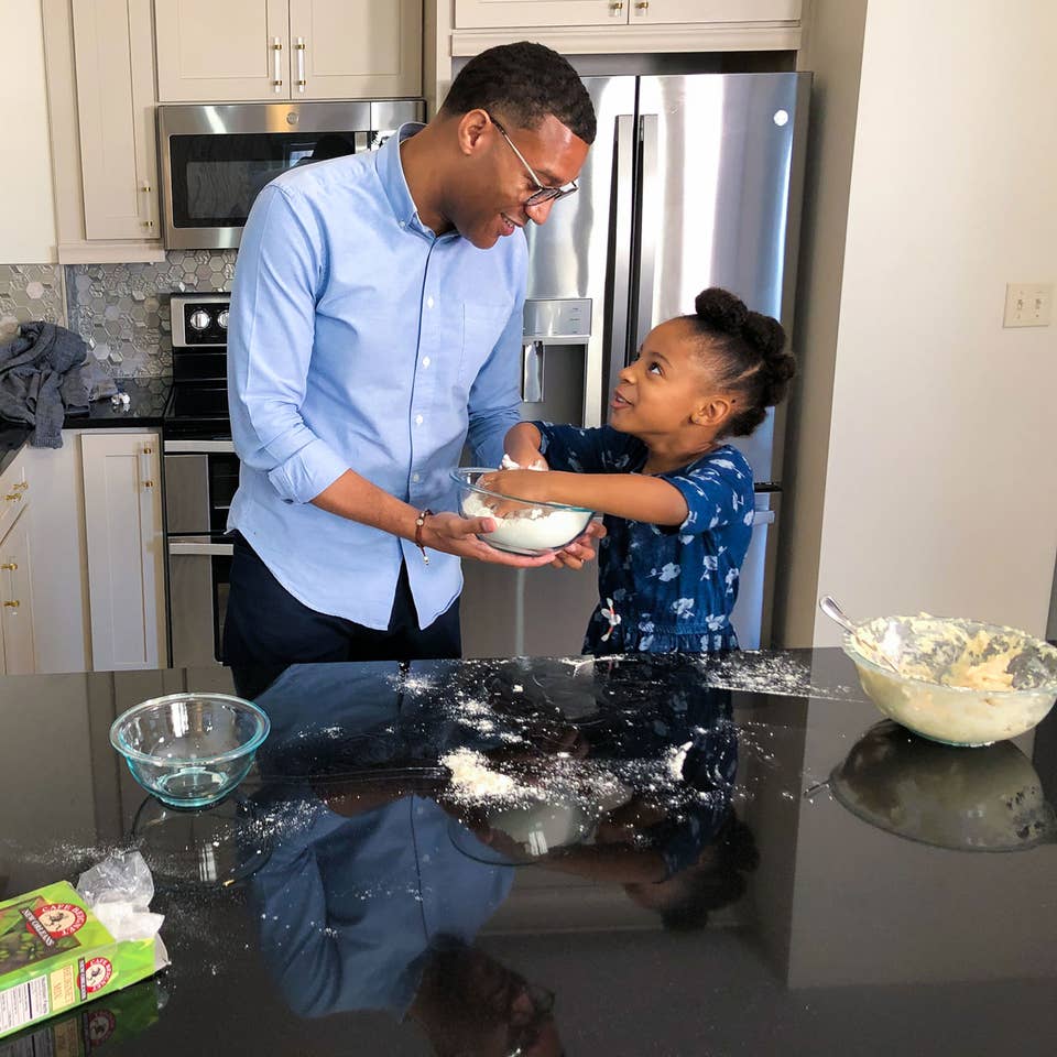 Father and daughter baking in a villa at New Orleans Resort in Louisiana.