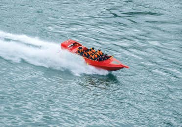 Red jet boat cruising near Galveston Beach, Texas