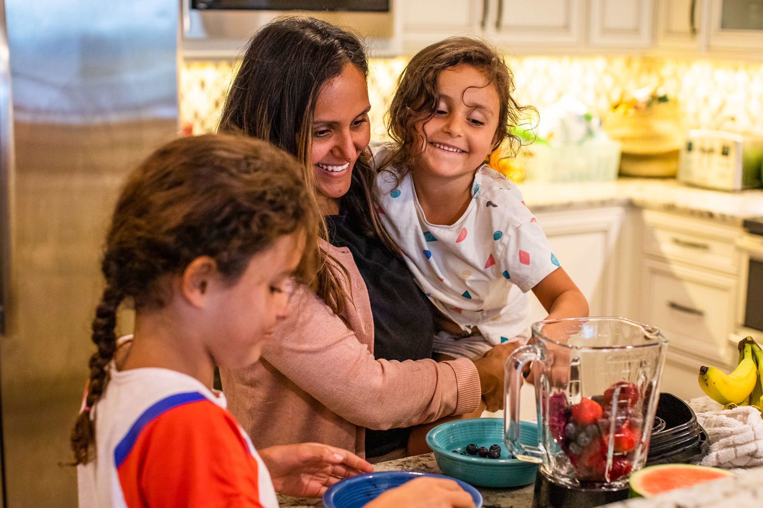 Brenda Rivera Sterns' family put mixed berries into a blender to make smoothies in the kitchen of our Signature Collection villa at our South Beach Resort in Myrtle Beach, South Carolina.