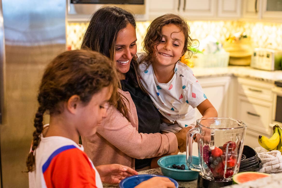 Brenda Rivera Sterns' family put mixed berries into a blender to make smoothies in the kitchen of our Signature Collection villa at our South Beach Resort in Myrtle Beach, South Carolina.