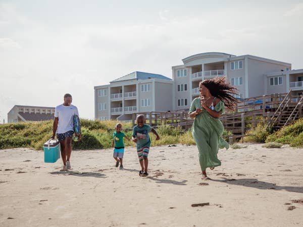 Family Walking to the beach at Galveston, Tx