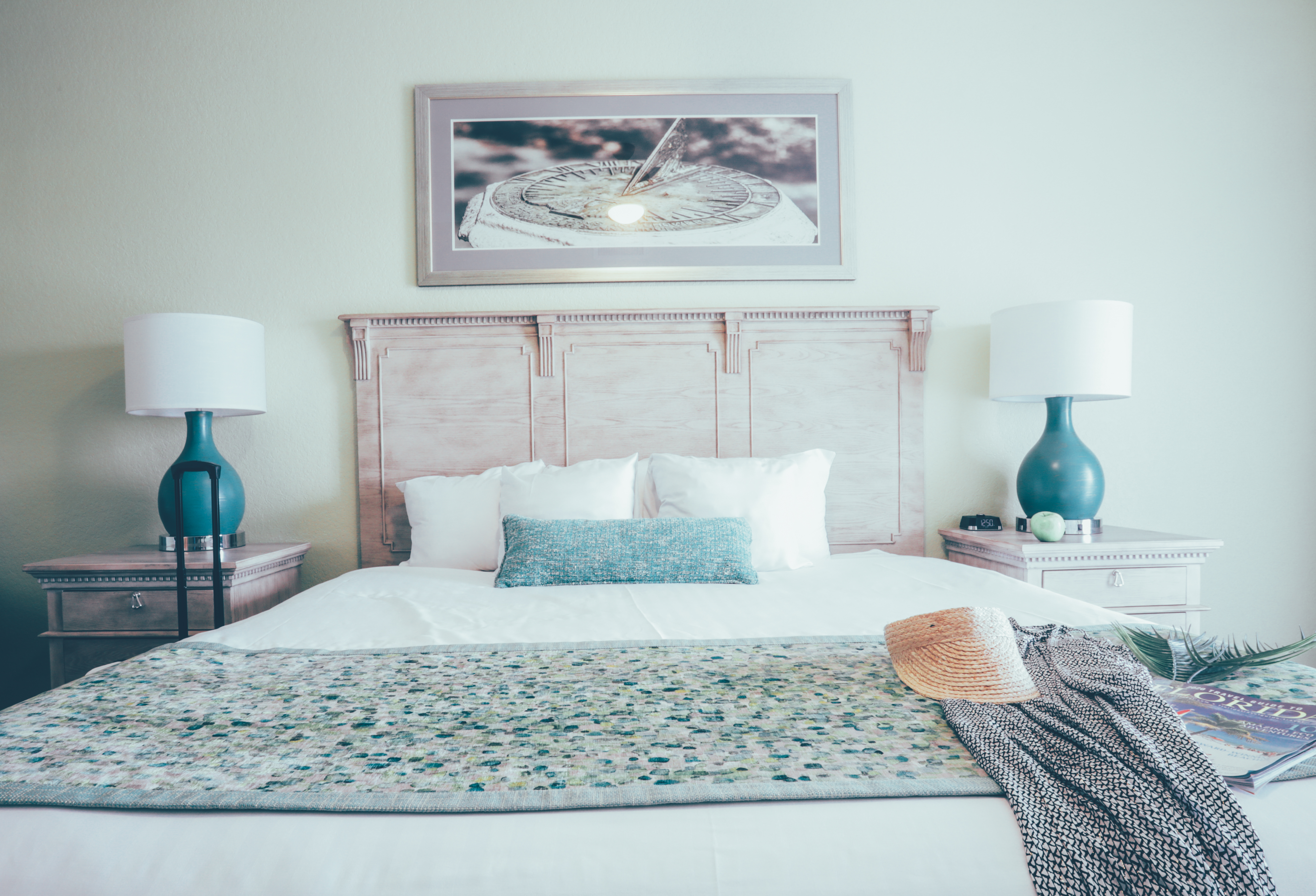 Bedroom with coastal decor and two night stands in a villa in River Island at Orange Lake Resort near Orlando, Florida