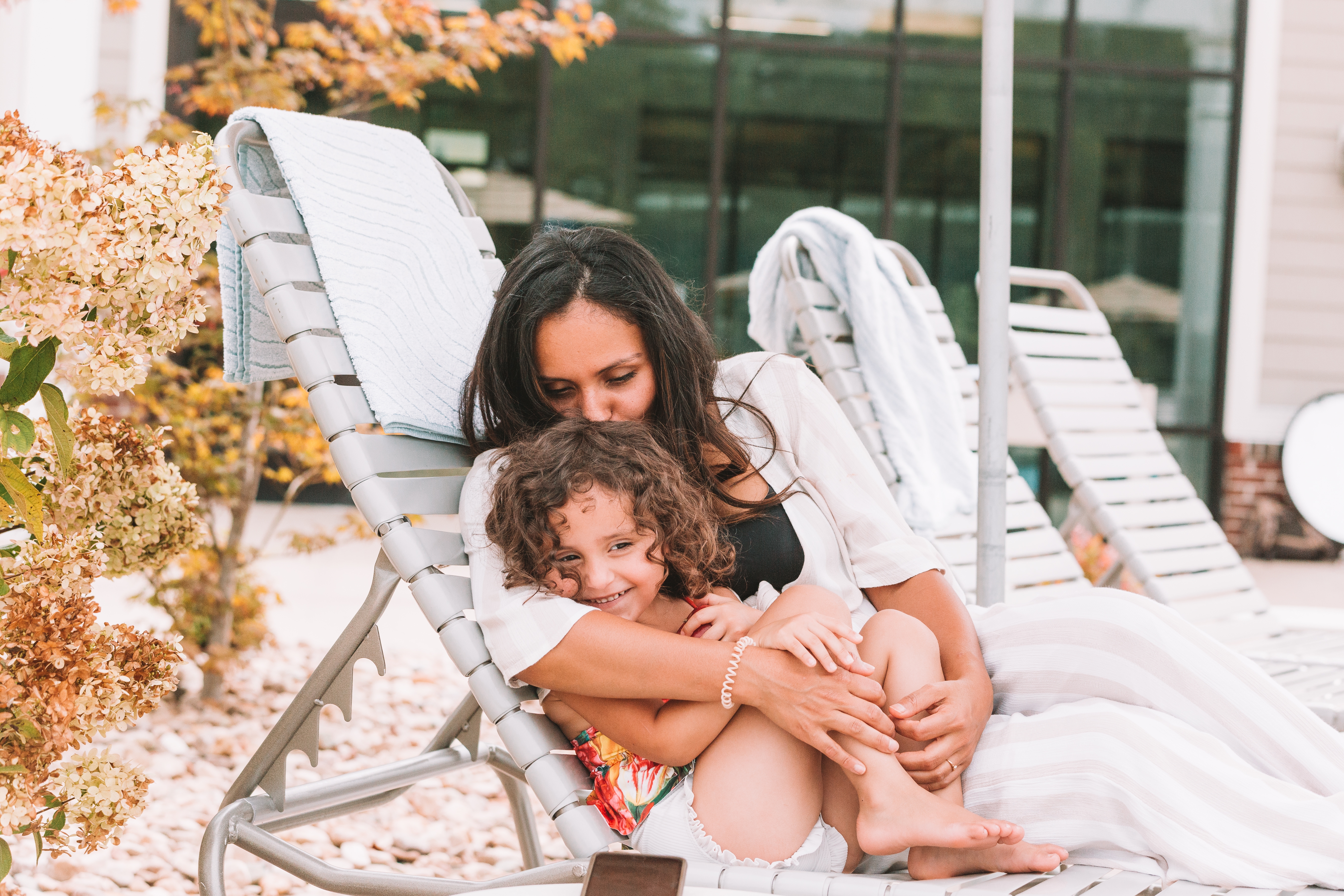 Mother and daughter sitting in a pool chair at Williamsburg Resort in Virginia.