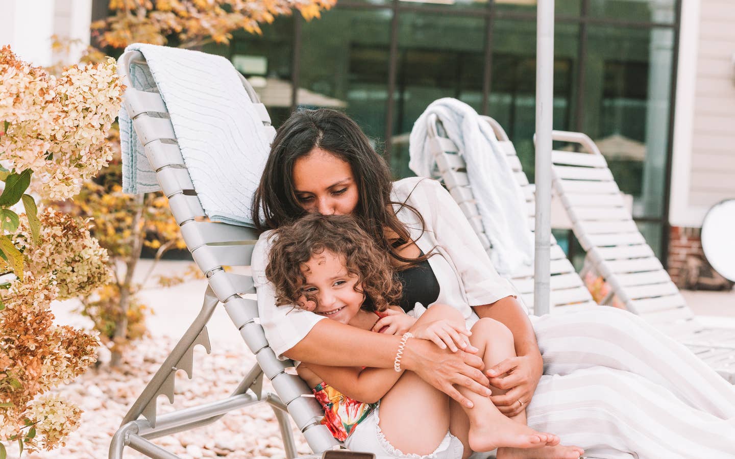 Mother and daughter sitting in a pool chair at Williamsburg Resort in Virginia.