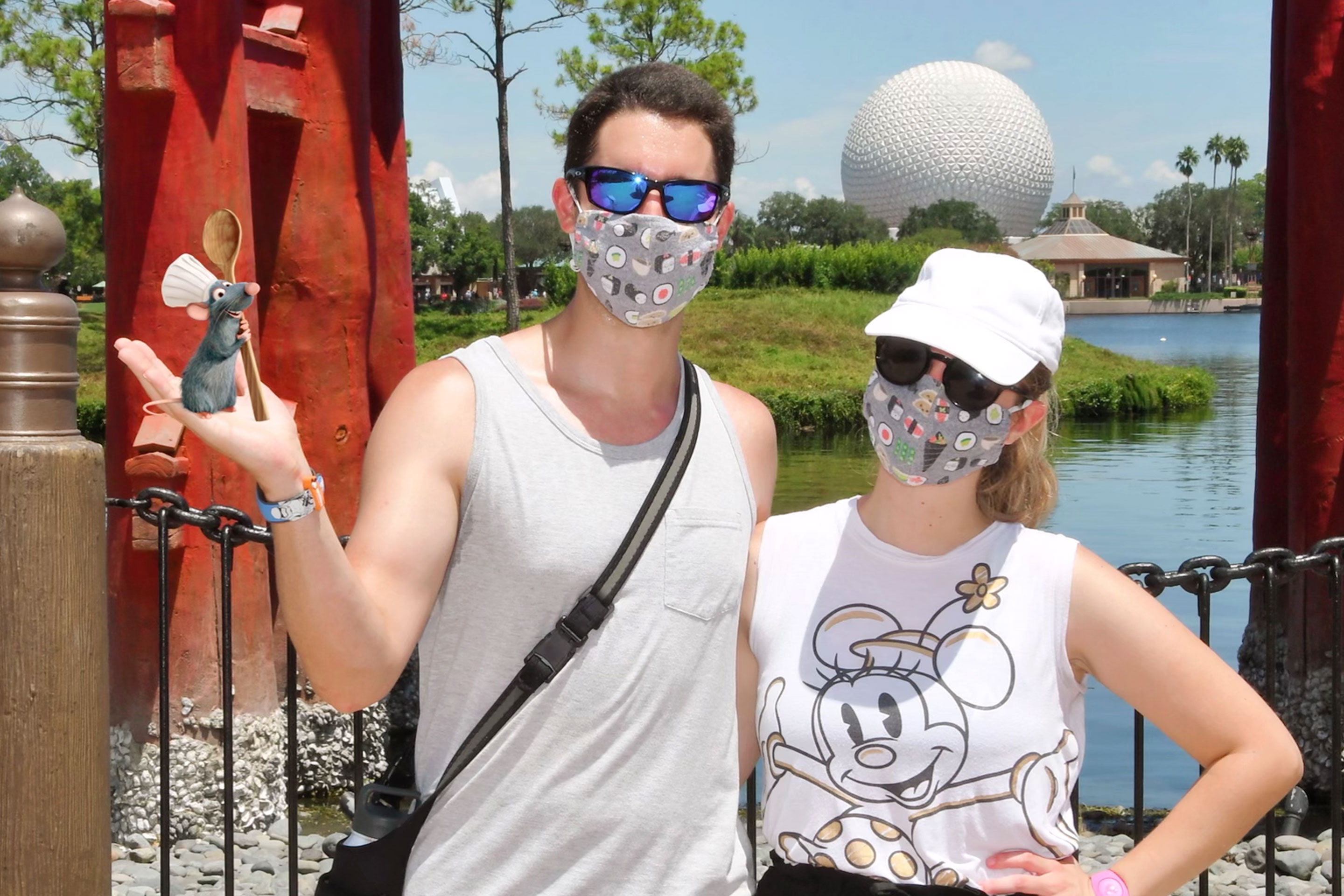 Featured author, Jessica Salina, with husband, Anthony, in Epcot World Showcase-Japan Pavilion get photobombed by Remy from Pixar's 'Ratatouille.'