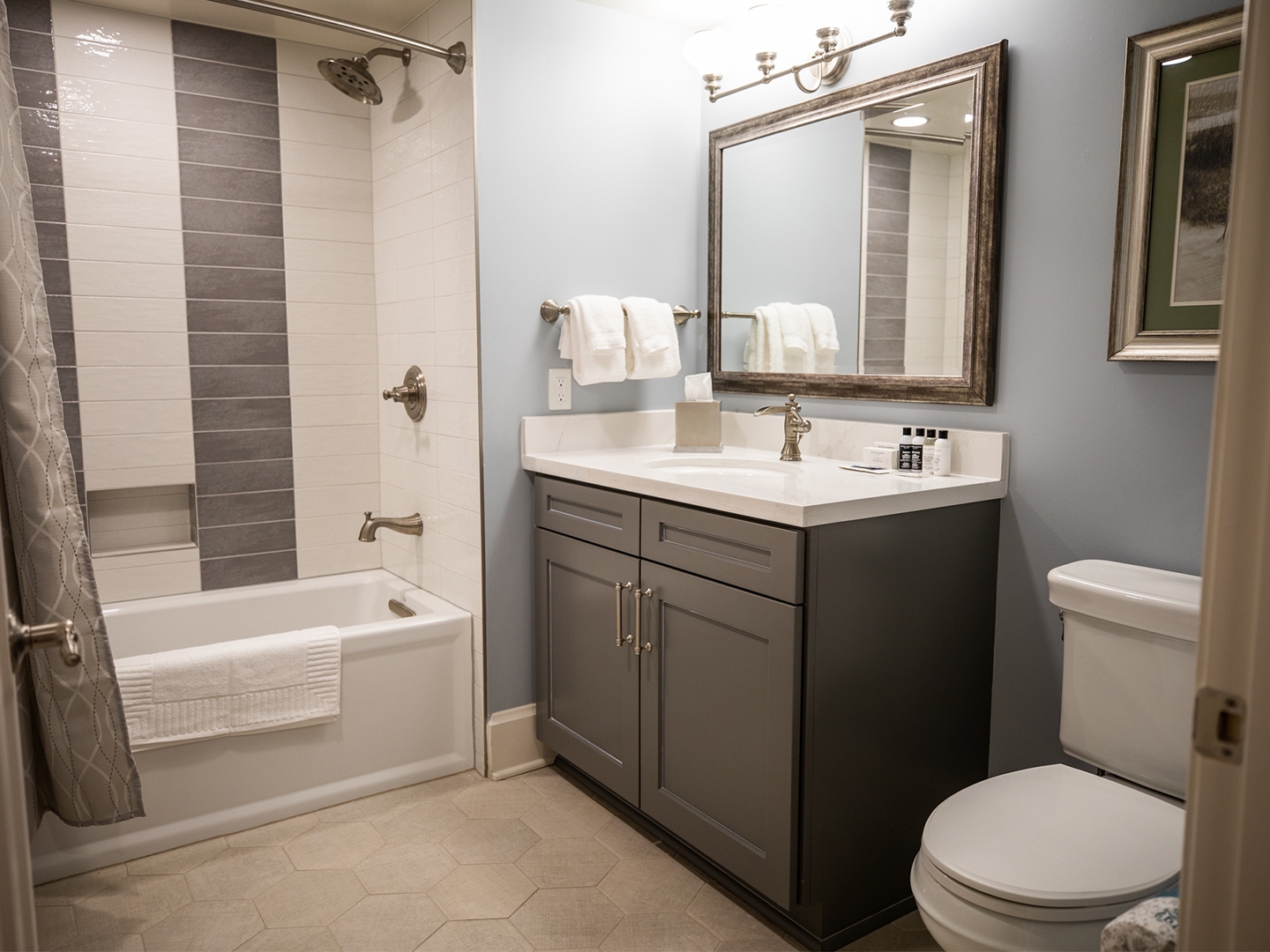 Bathroom with shower/tub combination in a two-bedroom Signature Collection villa at Cape Canaveral Beach Resort.