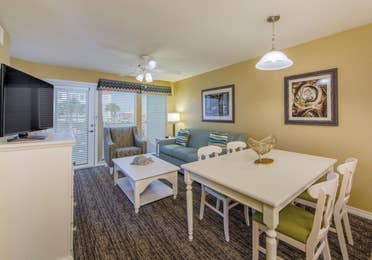 Living and dining room in a two-bedroom villa at Galveston Seaside Resort