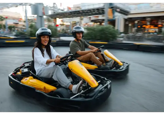 Teens racing go-karts at Octane Raceway Scottsdale Arizona.