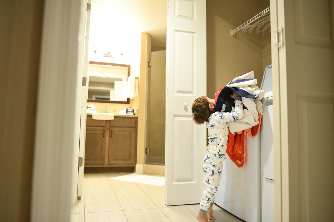 Raff's son doing laundry in villa